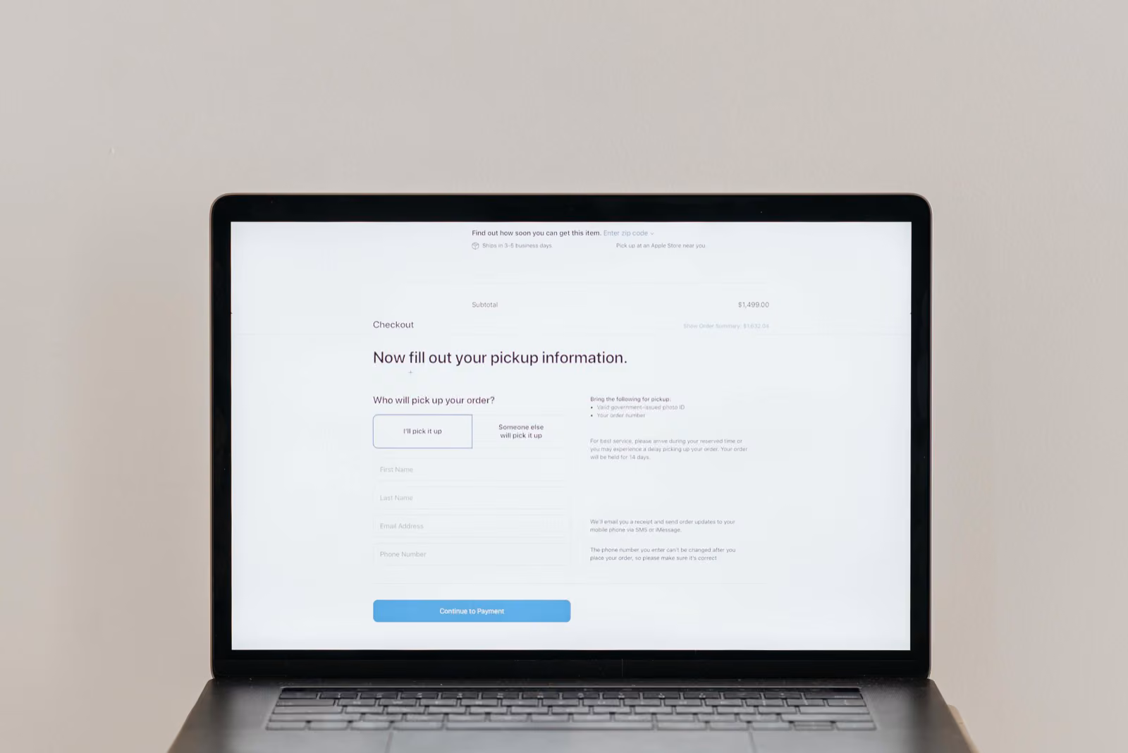 A split view of a laptop showing a website on one side and a data dashboard on the other