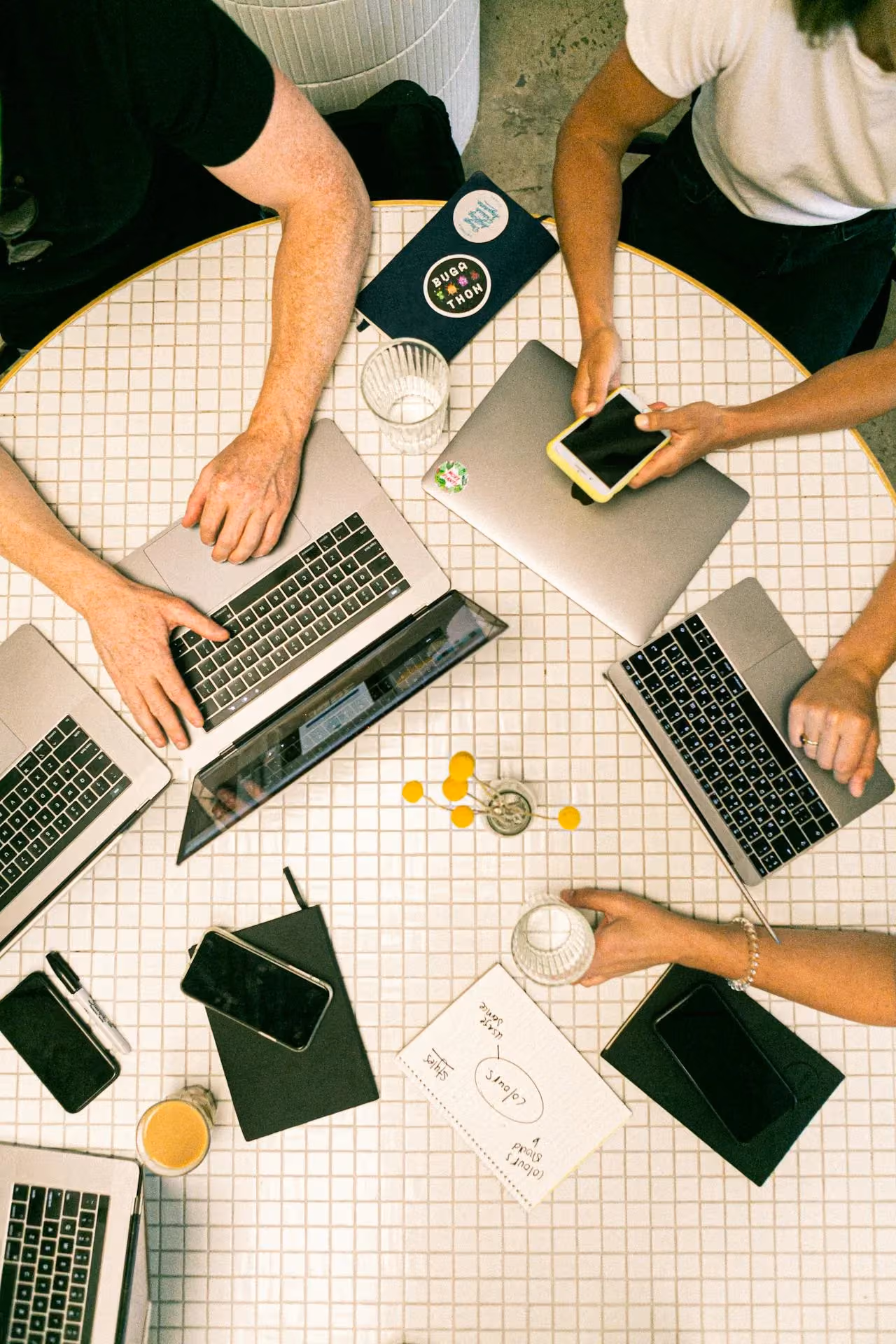 A team collaborating on laptops in an office, representing the kind of content planning that supports a LinkedIn strategy