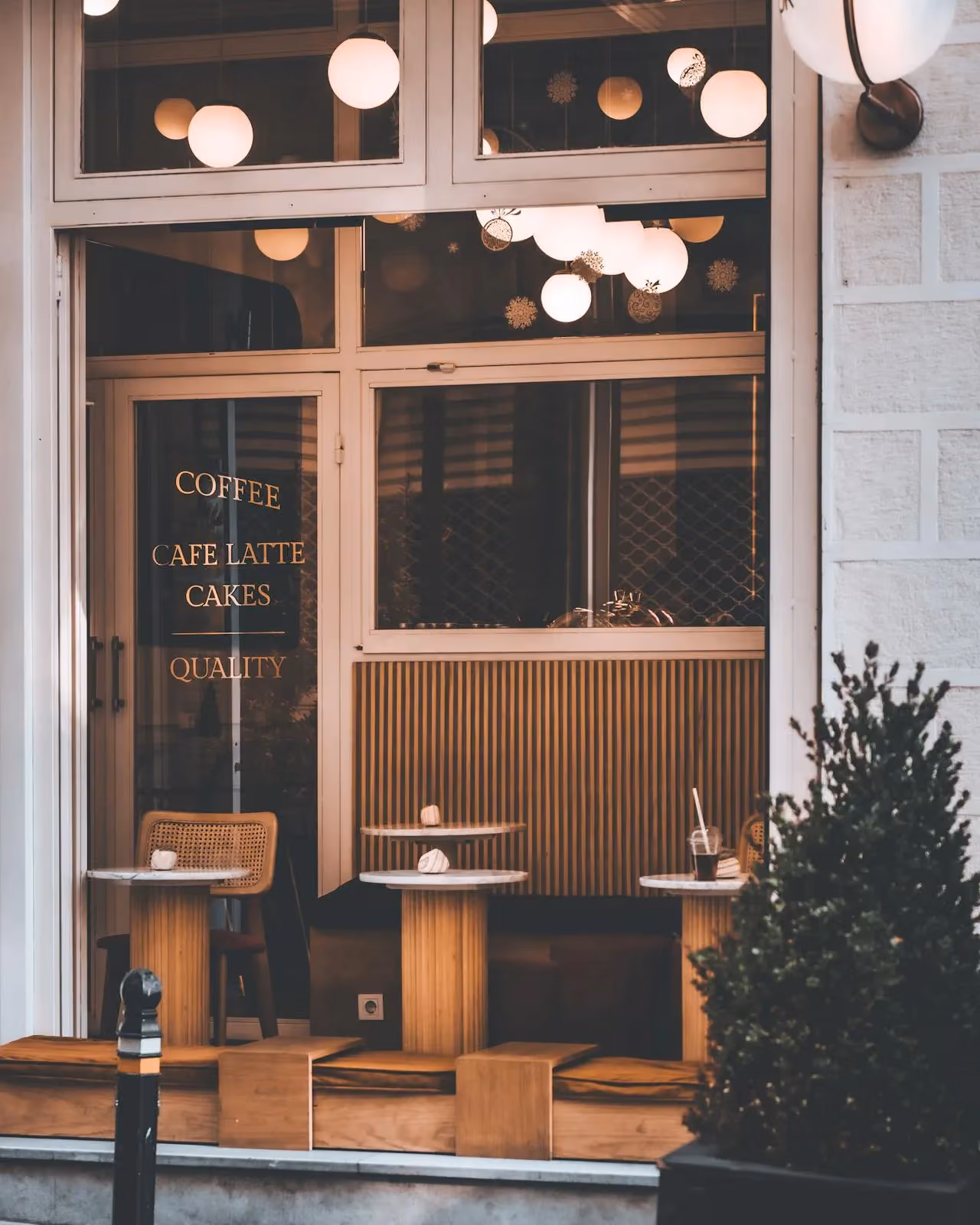 Welcoming coffee shop storefront with warm lighting
