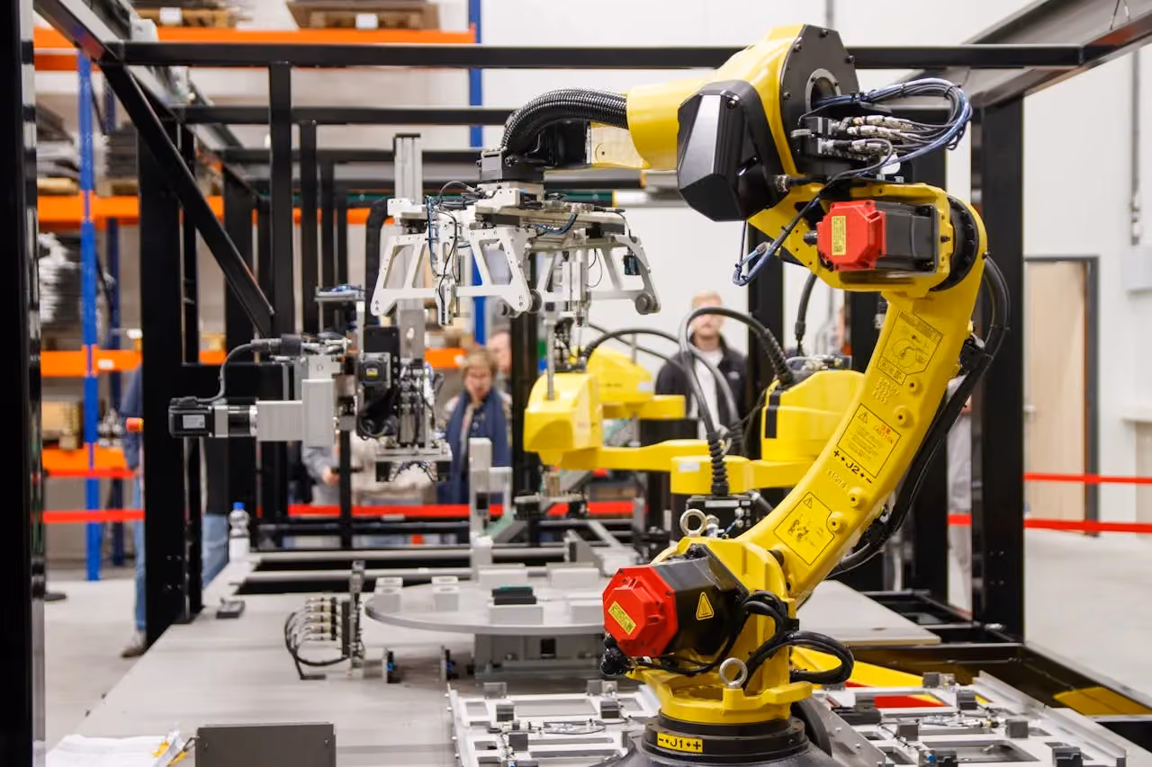 An industrial robot arm in a manufacturing facility, representing the kind of automation technology that Made Smarter funding can support