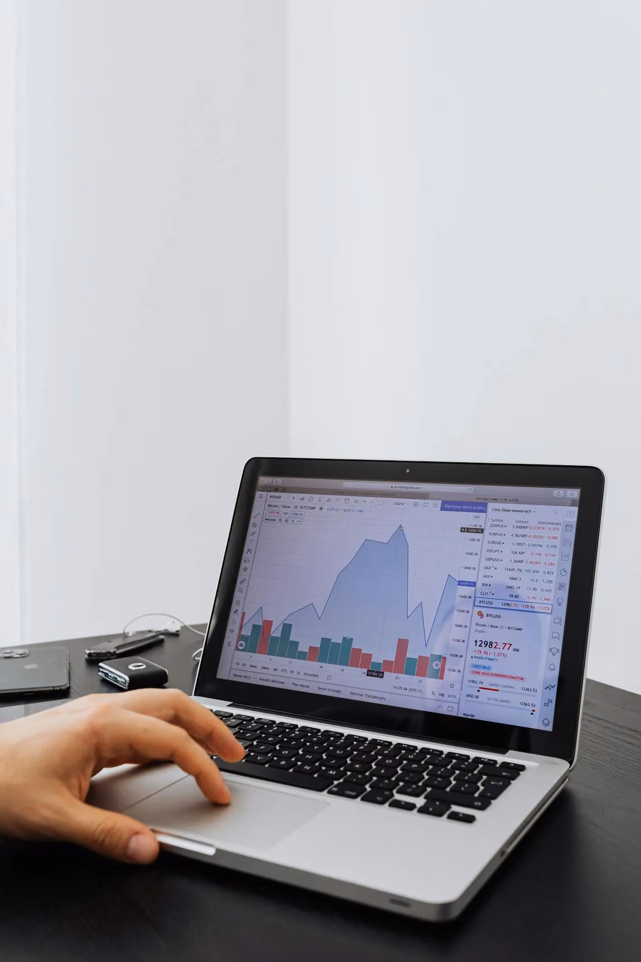 Person reviewing business analytics and data on a laptop screen in a home office setting