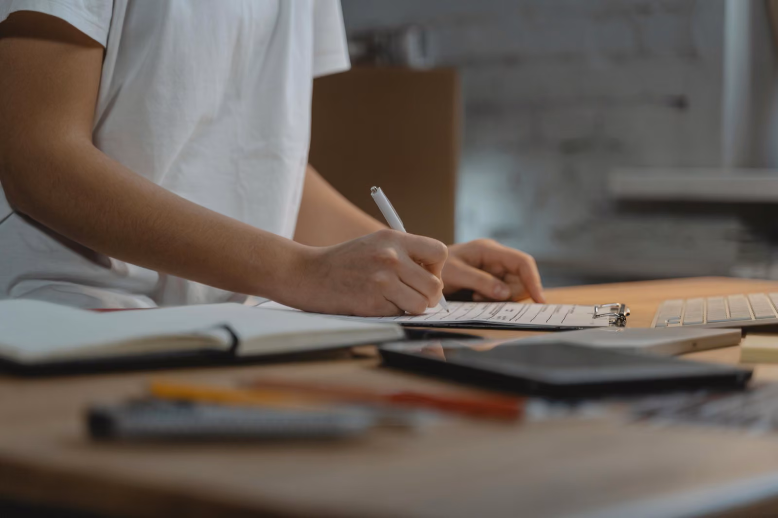 A small business owner reviewing a checklist on a clipboard