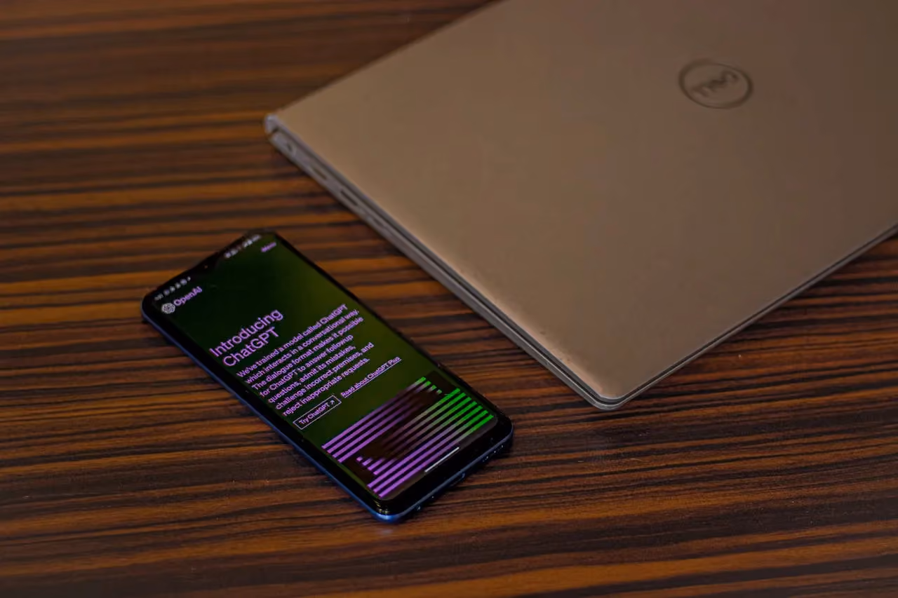 A laptop and phone showing the ChatGPT interface, illustrating how AI assistants are changing the way people search for information