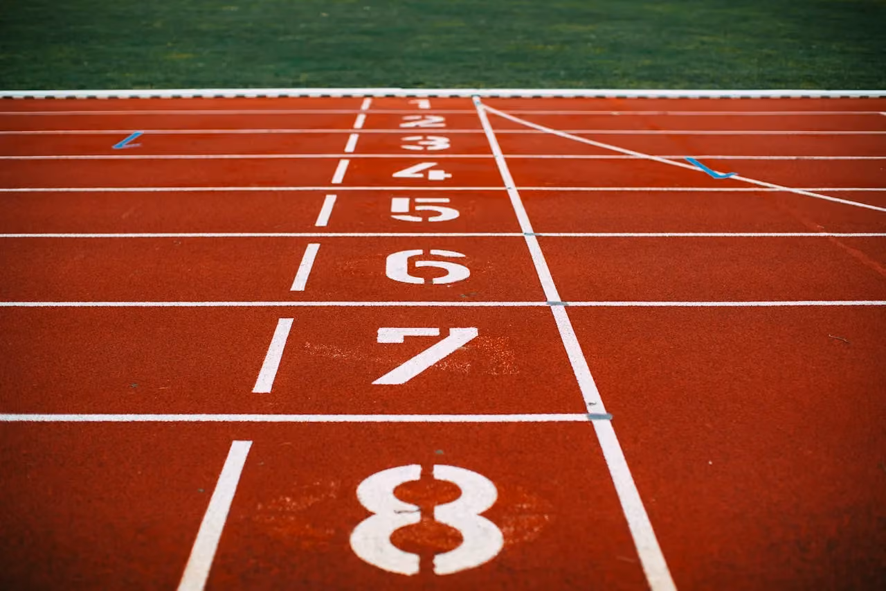 Close-up of a running track with numbered lanes, representing business competition and the race to rank higher