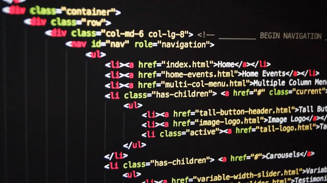 Close-up of colourful HTML and CSS code displayed on a dark computer screen